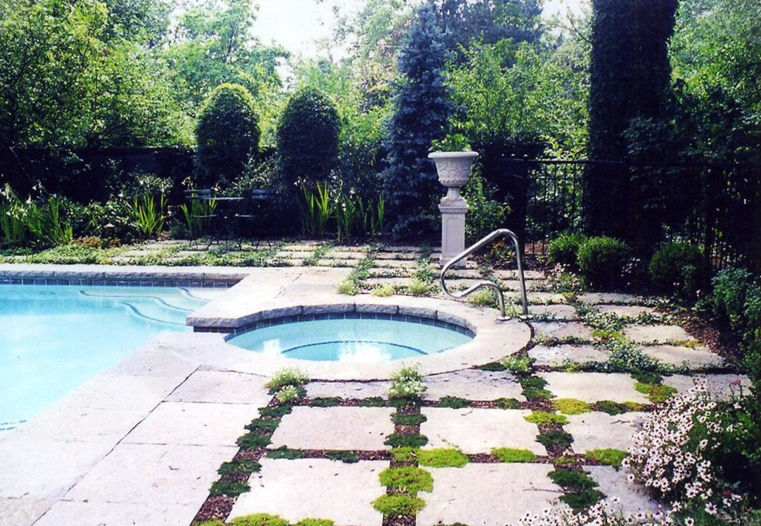 Pool with spa and stone surround